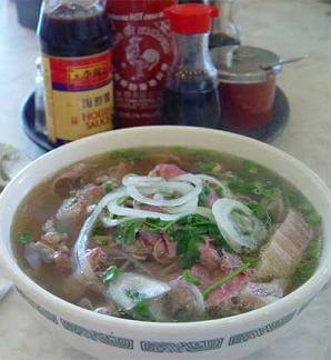 Vietnamese phở noodle soup with sliced rare beef and well done beef brisket.